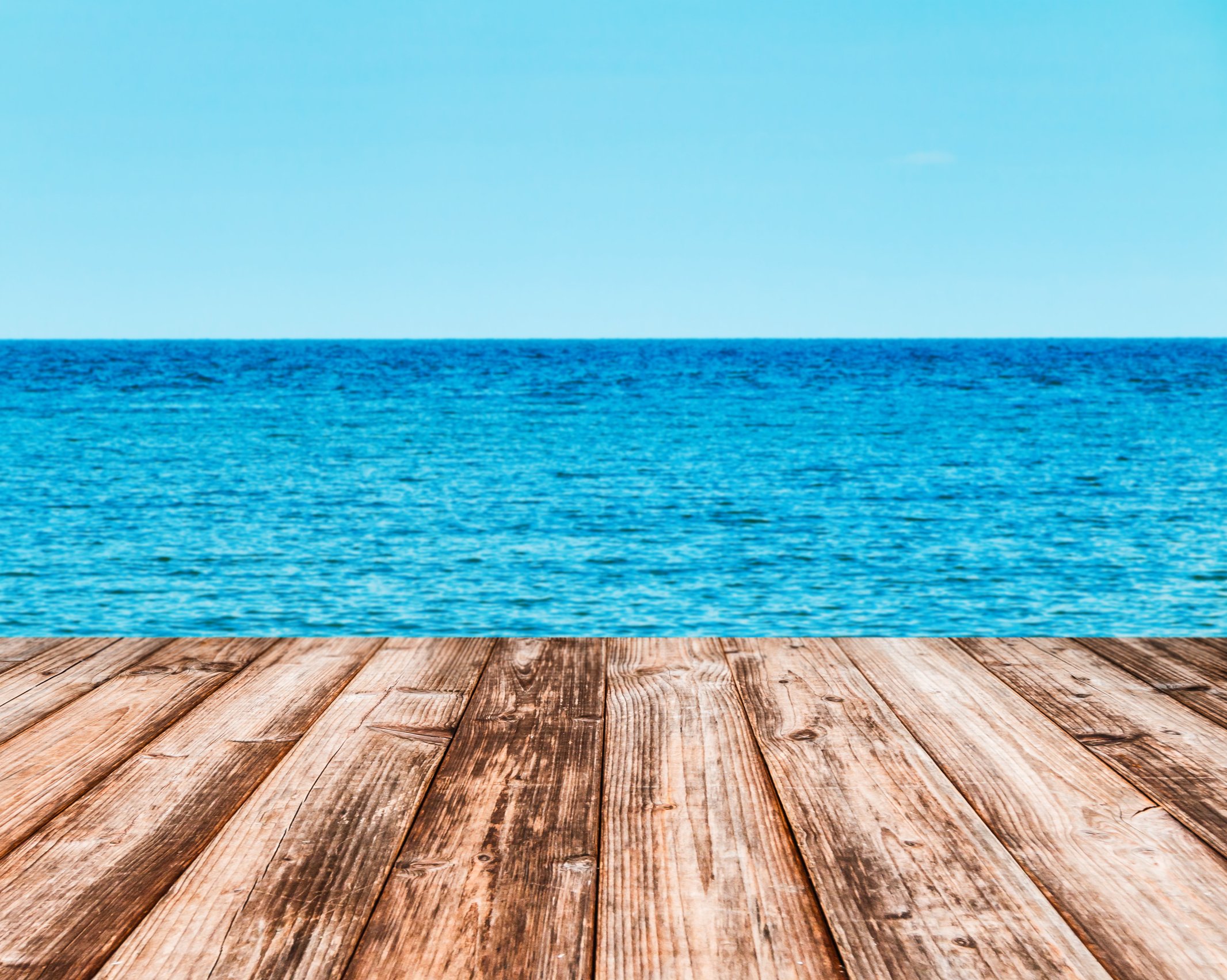 Coconut plank under image of peaceful sea